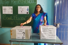School Parliament Election-2022-23- Principal Mam casting the vote